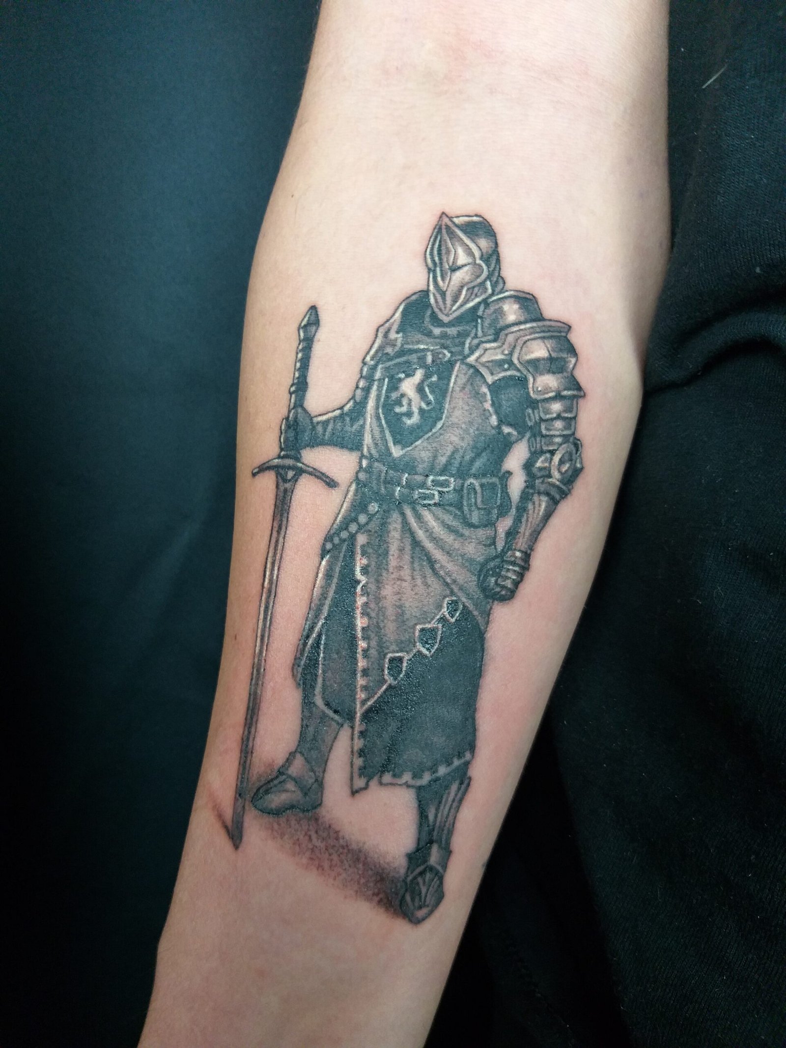 black and grey micro realism warrior tattoo on forearm by nat what i tat at 7th house tattoo fredericton new brunswick canada
