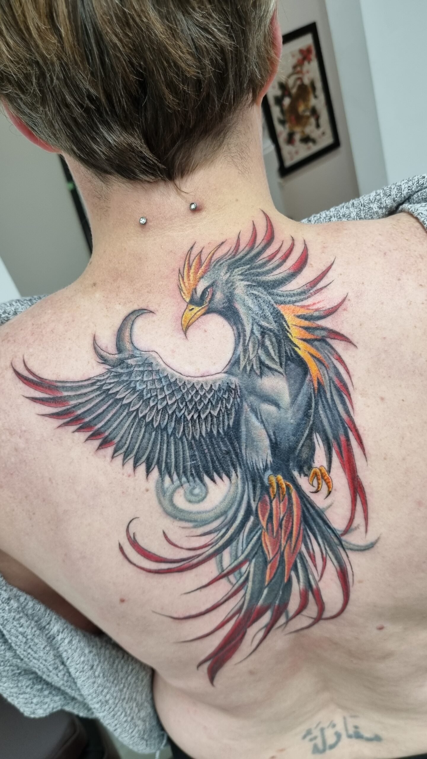 cover up black and grey pheonix tattoo on the back by nat what i tat at 7th house tattoo fredericton new brunswick canada