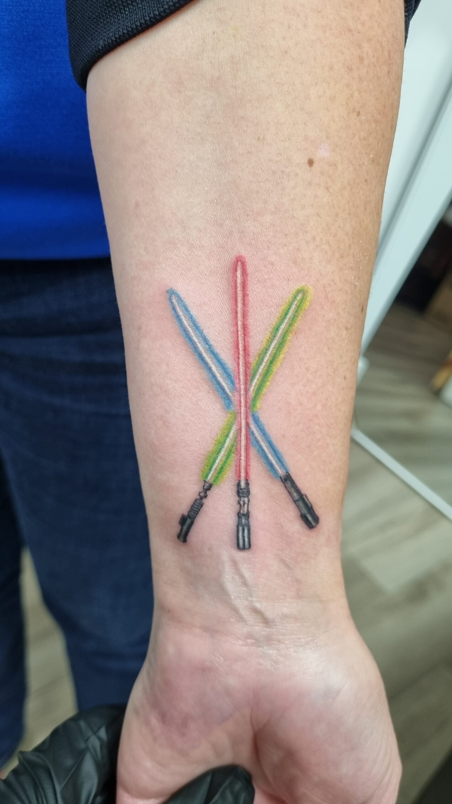 color realism 3 lightsabers star wars tattoo on forearm by nat what i tat at 7th house tattoo fredericton new brunswick canada